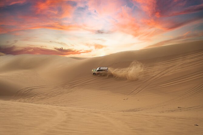 Abu Dhabi Morning Desert Safari: 4x4 Dune Bashing, Camel Ride and Sandboarding - Pickup, Group Size, and Seat Reality