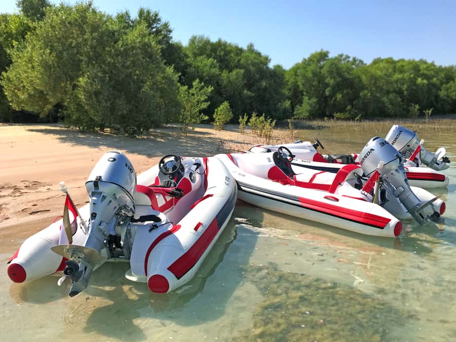 Abu Dhabi: Yas Island Self-Driving Guided Speedboat Tour - The modern Abu Dhabi finale: circular buildings, Egg-shaped towers, and Al Raha Creek