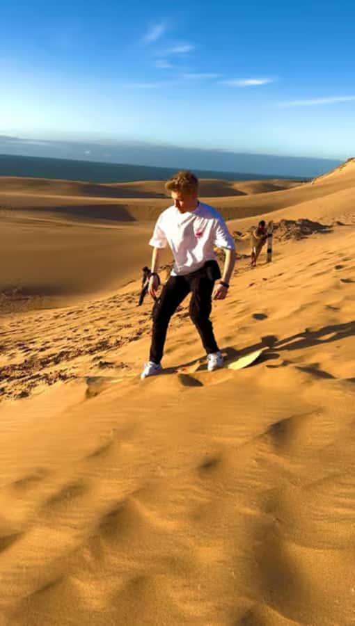 Best Agadir Desert Adventure: Quad Camel Sandboarding & BBQ - Timlalin Dunes: sandboarding, sunset, and the BBQ-style payoff