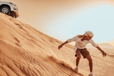 Deluxe Sunset Desert Safari: SandSurfing, Camel Ride & BBQ dinner - 4x4 Red Dunes: dune bashing that’s thrilling but not all-day