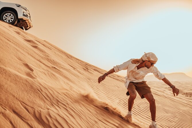Deluxe Sunset Desert Safari: SandSurfing, Camel Ride & BBQ dinner - 4x4 Red Dunes: dune bashing that’s thrilling but not all-day