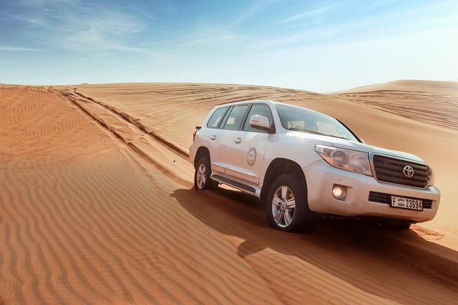 Desert Safari Dubai with Dune Bashing, Sandboarding, Camel Ride, 5 Shows, Dinner - Sunset Photos, Henna, and Arabic Dress: The Cultural Bits That Aren’t Just Props