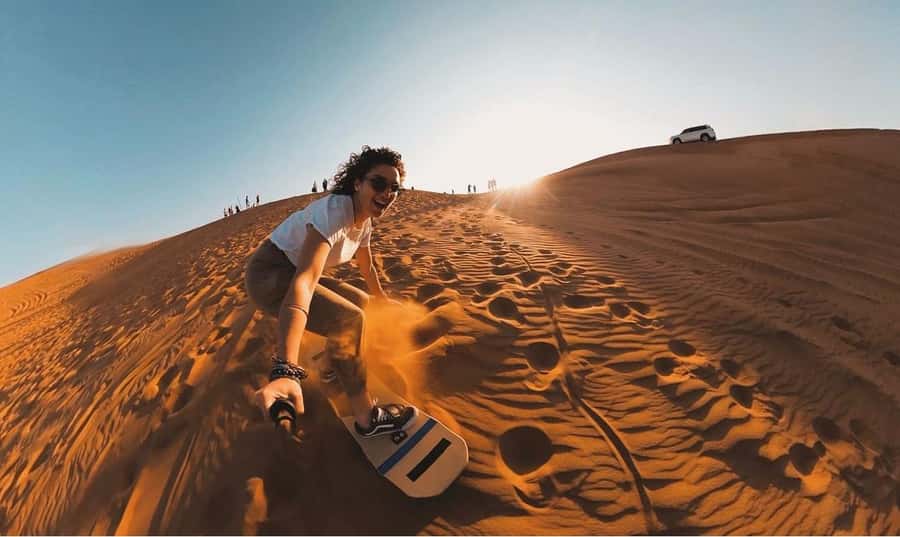 Doha: ATV/Desert Safari with Activities and Inland Sea Stop - Sandboarding on the dunes: the easiest way to feel like you belong out there