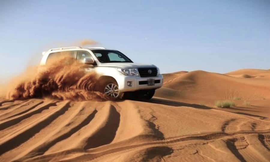 Doha: Desert Safari Dune Bashing, Sandboarding, & Camel Ride - The first stop near 24 Beach Road: camel ride plus local tea