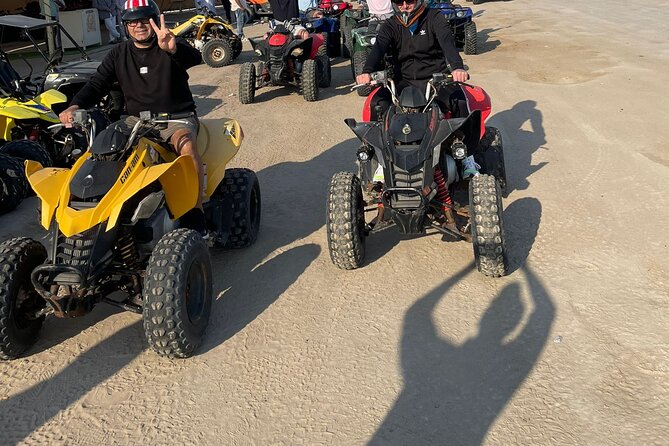 Doha Qatar ATV Quad Bike Buggy Dune Bashing and Camel Ride - The dune bashing and sandboarding combo: where the desert gets loud