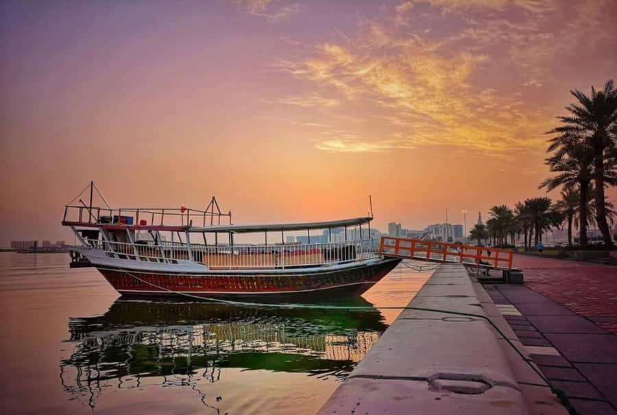 Doha: Sunset Serenade Skyline Dhow Cruise with Buffet Dinner - Onboard setup: open-air deck for skyline shots, indoor comfort for the ride