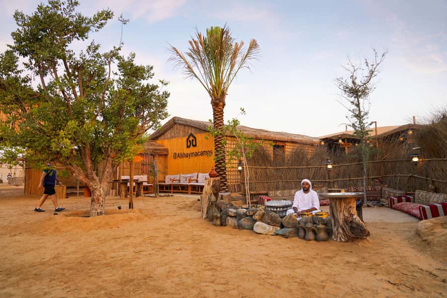 Dubai: Al Khayma Camp Experience with BBQ Dinner - Camel feeding, short camel rides, and sunset photo time