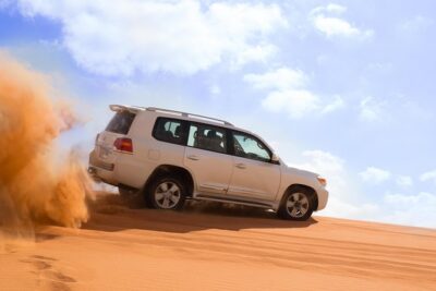 Dubai Desert Journey: Red Dunes Safari with BBQ in Bedouin Camp - Pickup, 4WD vehicles, and getting the seat you’ll thank yourself for