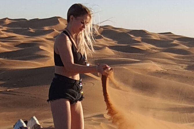 Dubai Desert Safari & Buffet Dinner and Camel ride with PRIVATE CAR - Sunset photo stop + sandboarding: the action with a payoff