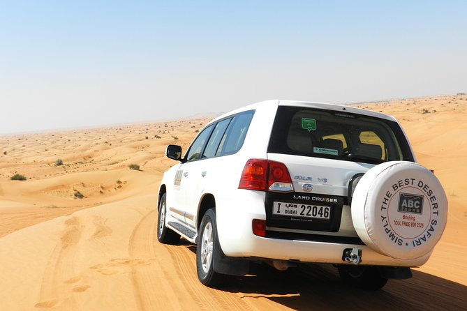 Dubai Desert Safari with BBQ, 3 Shows & Camel Ride at Majlis Camp - From Your Dubai Hotel to the Dunes: Pickup, SUV Comfort, and Tire Deflation