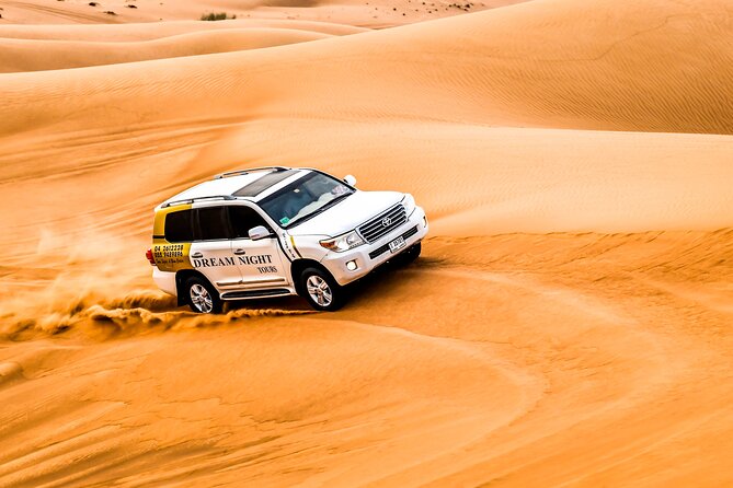 Dubai Desert Safari with Dune Bashing, Camel Ride, & BBQ Dinner - Live Entertainment at Night: Belly Dance, Tanoura, Fire Show