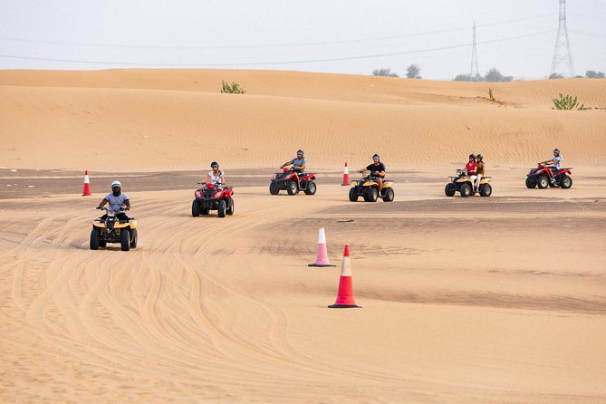 Dubai Desert Safari with Quads, BBQ Dinner, Camel ride, & Shows - BBQ Dinner Under the Stars: Shawarma, Kebabs, Belly Dancing, and Tanoura