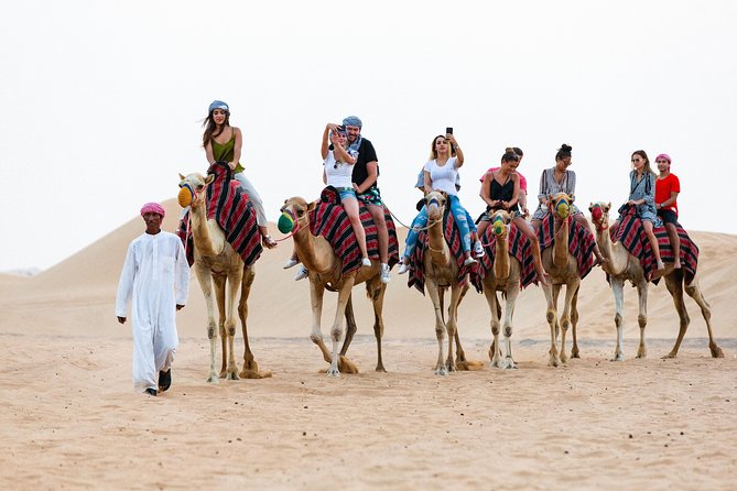 Dubai Desert Safari with Quads, BBQ Dinner, Camel ride, & Shows - Quad Bike Across the Dunes: Helmets, Safety Briefing, and Real Adrenaline