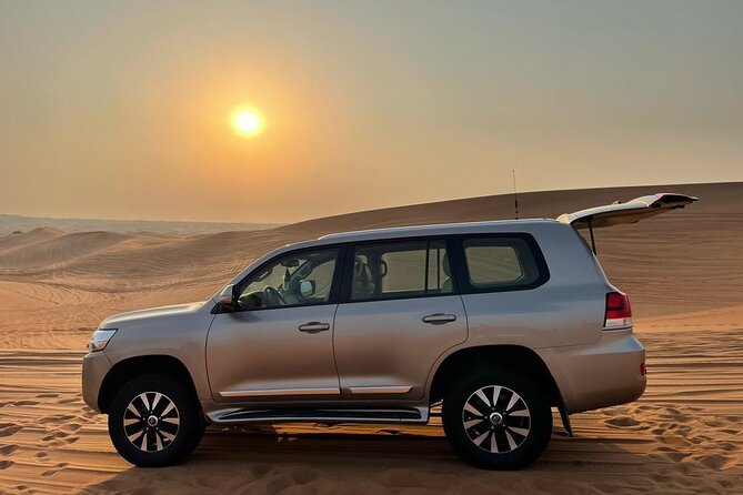 Dubai Evening Desert Safari With Transfers Dune Bashing & Dinner - Dinner under the stars: BBQ buffet plus a full live show run