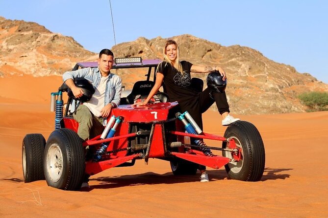 Dubai Evening Desert Safari With Transfers Dune Bashing & Dinner - Dune bashing and sandboarding at golden sand speed