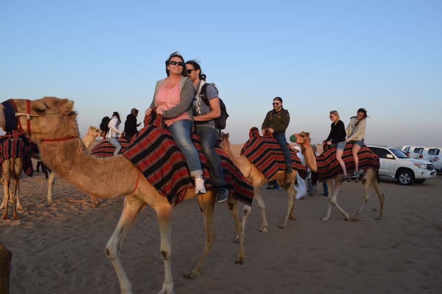 Dubai: Evening Tour with Quad Biking, Camel Ride, and BBQ - Pickup, the desert rest stop, and why this part matters