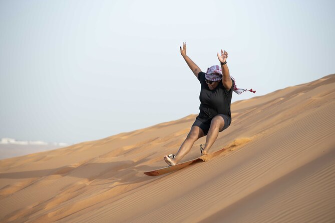 Dubai Half-day Red Dunes bashing with Sandboarding, Camel &Falcon - Arabic Dressing, Henna, and Falcon Photos: More Than Just a Photo Stop
