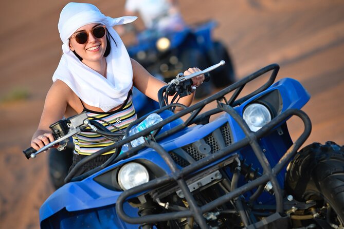 Dubai Morning Evening Desert Safari,Sand boarding and Camel ride - ATV or quad bike option: the extra thrill, inside a fenced area