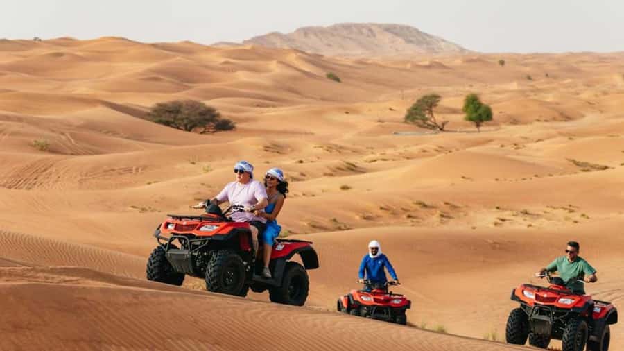 Dubai: Quad Bike, Dune Buggy, and Sandboarding Experience - Sandboarding down Dubai’s red dunes