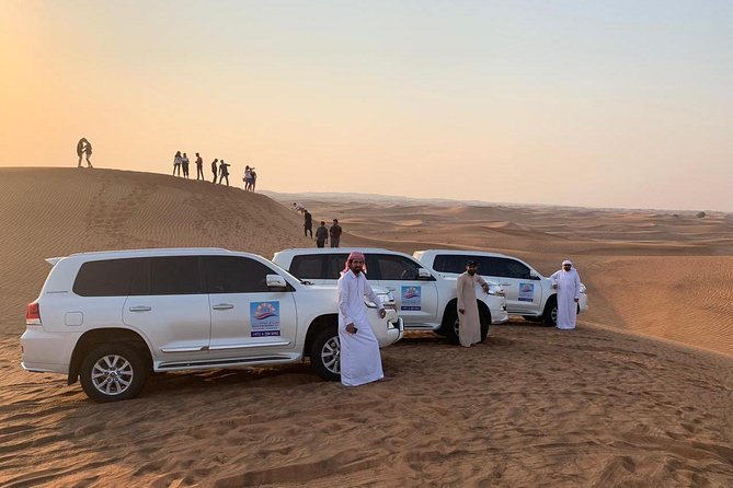 Dubai Red Dunes Desert Safari : Sandboarding, BBQ & Live Shows - Sandboarding and camel rides: two ways to play the dunes