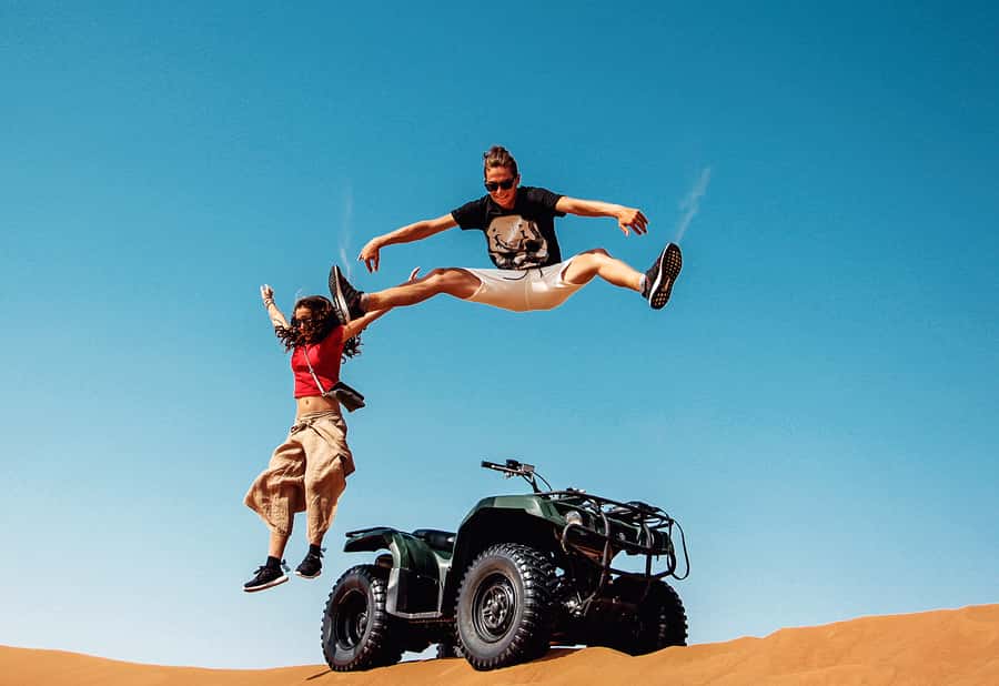Dubai: Red Dunes Quad Bike with Sandboarding, Camels and BBQ - Entering the Desert: What the 7 Hours Feels Like