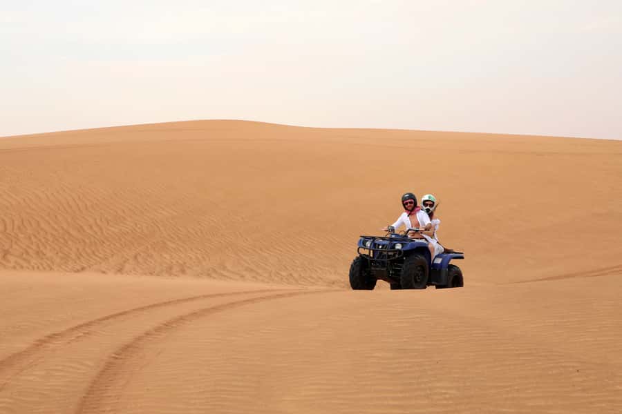 Dubai: Red Dunes Quad Bike with Sandboarding, Camels and BBQ - Sandboarding and Camel Time: Short, Fun, and Built for Photos