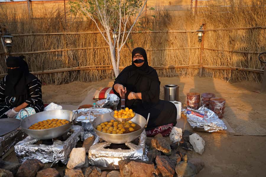 Dubai: Red Dunes Quad Bike with Sandboarding, Camels and BBQ - Al Khayma Desert Camp: Coffee, Falcons, Henna, and Costumes