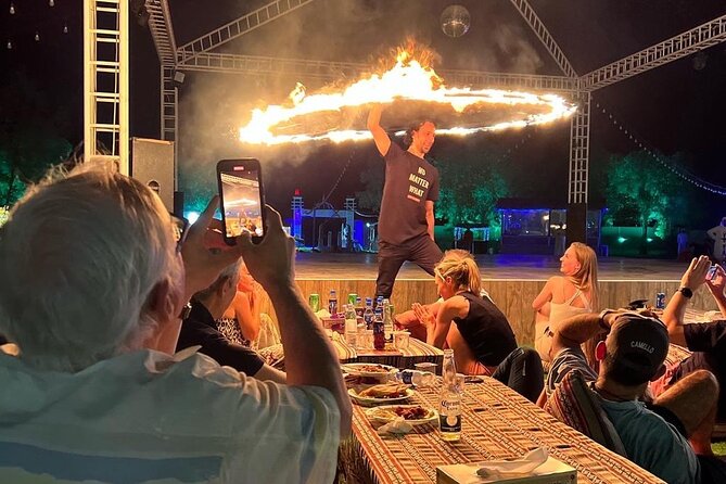 Dubai: Red Dunes, Sandsurf, Camel Ride, BBQ Dinner at Desert Camp - Dinner at the desert camp: international buffet, and why taste varies
