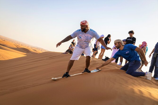 Dubai Red Dunes with Sandboarding, Camel Ride, Falcon & VIP Camp - Dune bashing and sandboarding: adrenaline with real instructions