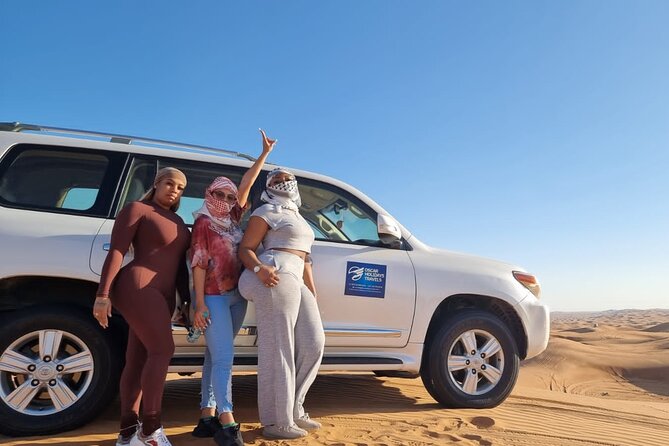 Dubai Red Dunes with Sandboarding, Camel Ride, Falcon & VIP Camp - Camel ride and the falcon moment for easy, memorable photos