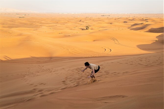 Dubai Red Dunes with Sandboarding, Camel Ride, Falcon & VIP Camp - Bedouin-style VIP camp: shows, henna, shisha, and fire