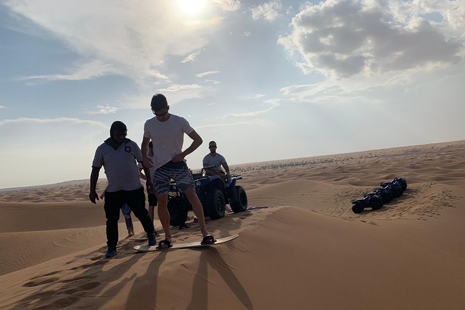 Dubai: Unique SUNSET Quad Bike Red Dunes Safari - Sandboarding at Sunset: A Different Kind of Adrenaline