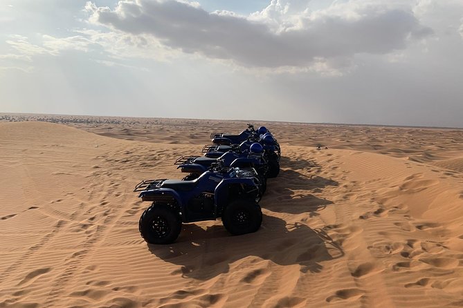 Dubai: Unique SUNSET Quad Bike Red Dunes Safari - Camel Ride: The Slow-Motion Desert View