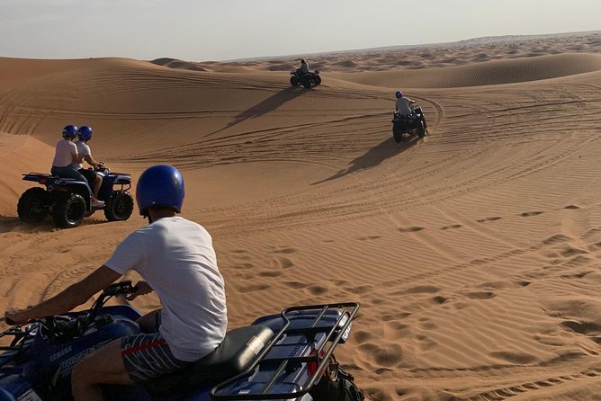 Dubai: Unique SUNSET Quad Bike Red Dunes Safari - Desert Camp Dinner: BBQ Buffet, Belly Dance, and Henna