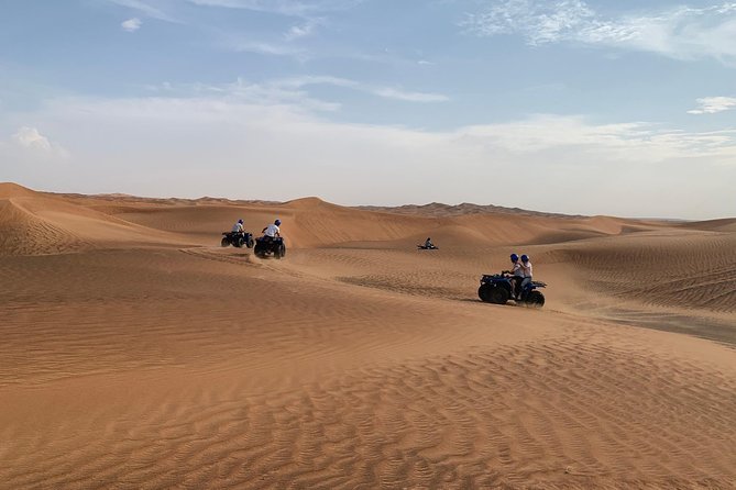 Dubai: Unique SUNSET Quad Bike Red Dunes Safari - Quad Bike Hour on High and Extreme Dunes
