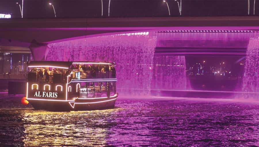 Dubai: Water Canal Cruise and La Perle Show with Dinner - Boarding The Dhow: Comfortable, Glassed-In Views Plus Outdoor Air