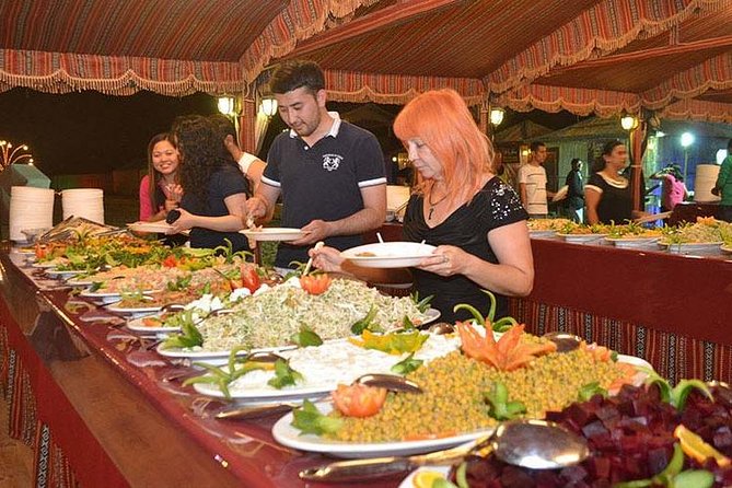 Evening Desert Adventure: Quad Biking, Sandboarding & Camel Ride - Night entertainment: Tanoura, belly dancing, and the show rhythm