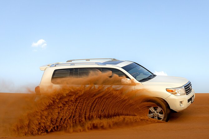Evening Desert Safari in Dubai, Sandboard & BBQ Dinner - Getting to Lahbab High Red Dunes in a 4x4 SUV
