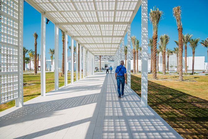 From Dubai: Abu Dhabi Day Tour with Grand Mosque & Louvre Museum - Photo stops at Etihad Towers, Emirates Palace, and the Corniche