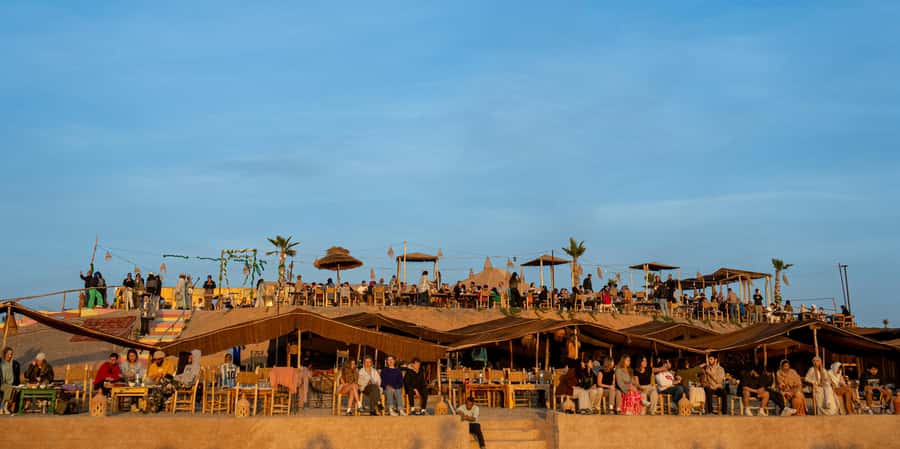 From Marrakech: Sunset Desert Tour with Camel Ride & Dinner - Dinner Under Starlight: What You’ll Eat and How It Feels