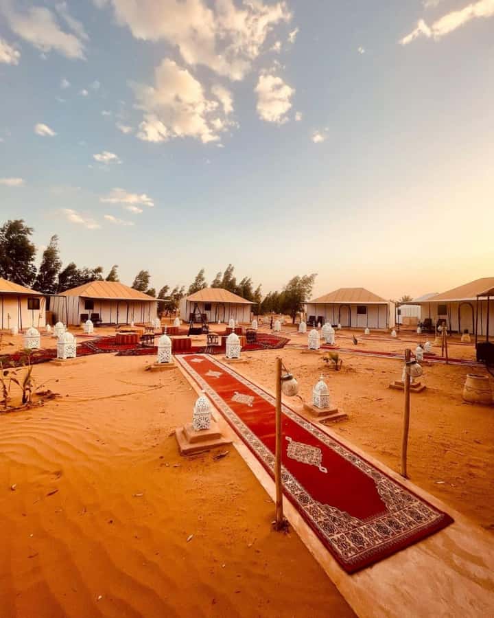 From Merzouga: Overnight Camel Trek over Erg Chebbi Dunes - Sunset camel ride and sandboarding: the first big wow