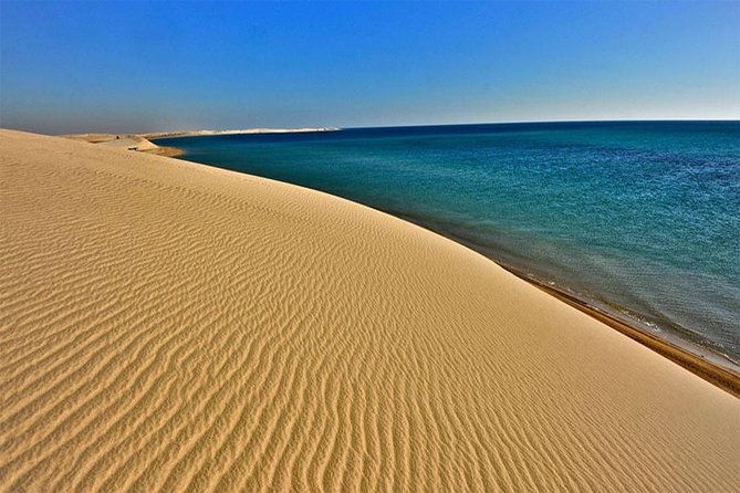 Half Day Desert Safari || Sand Boarding || Camel Ride || Inland Sea Visit || - Khor al-Udaid Inland Sea visit: big dunes, clear water, and a desert calm