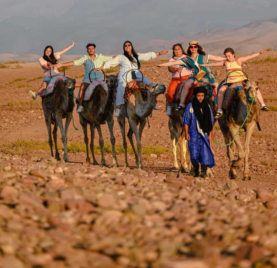 Marrakech: Agafay Desert Sunset, Camel Ride, and Dinner Show - Getting There: Marrakech Pickup, AC Bus, and Sunset Timing
