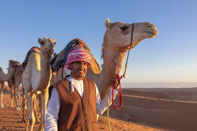 Morning Desert Safari with Quad Bike, Camel Ride & Sandboarding - Camel ride: the classic desert moment, scheduled and timed