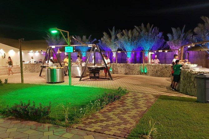 Premium Desert Safari Sharing Transfer with 5<em> Unlimited Buffet – Unlimited BBQ Dinner: How the Buffet Works and What to Expect’ /><br />
Dinner is live BBQ plus an unlimited buffet of international food. You’ll have both vegetarian and non-vegetarian options, and the buffet includes soft drinks and mineral water. Arabic coffee and tea usually happen earlier with the dates, so your meal is more of a paced evening than one long scramble.</p>
<p><p>Food quality is the biggest “make or break” variable on desert safaris, and this tour shows a clear split in feedback:</p>
</p>
<ul>
<li>Some reviews call the food plentiful, clean, and among the best at tourist camps.</li>
<li>Others described the buffet as mediocre or even horrible, plus one complaint about disgusting toilets.</li>
</ul>
<p><p>To be fair, operators sometimes improve offerings. In one response, the camp emphasized a larger buffet and said they’ve moved to a massive setup (they even mentioned about 70 dishes served daily). That suggests the food may be better than older reviews you might read elsewhere.</p>
</p>
<p><p>So how should you approach the buffet? Treat it like you’re going to sample, not hunt for a single “perfect dish.” Unlimited means you can try a little of everything and build your own best plate. Also, since it’s BBQ-style with international items, you’ll likely find something familiar even if you don’t want to gamble on spices.</p>
</p>
<p><p>Two practical ideas:</p>
</p>
<ul>
<li>Go a little earlier in the dinner window if you want the hottest items.</li>
<li>If food service at your table isn’t included (it isn’t), don’t wait for someone to bring plates. The buffet setup is meant for self-service.</li>
</ul>
<h2 id="the-shows-tanoura-fire-and-belly-dance-expect-variation">The Shows: Tanoura, Fire, and Belly Dance (Expect Variation)</h2>
<p><img width="669" height="446" decoding="async" src=