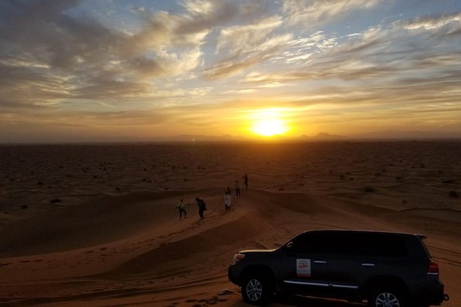 Private Evening Red Sand Desert Safari with BBQ Dinner - Camel Ride and Henna Painting at the Camp