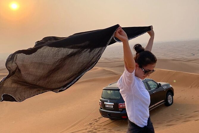 Red Dunes Desert Safari Dubai with Dinner Buffet, Show & Transfer - Camp activities: camel ride, sandboarding, henna, and costume photos
