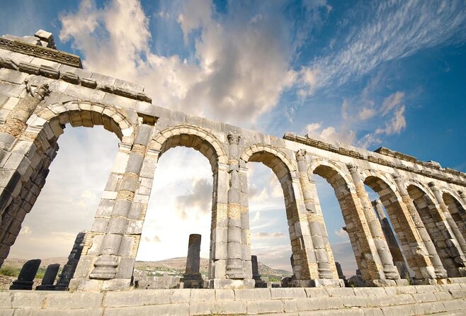 Small-Group Full-Day Meknes, Volubilis and Moulay Idriss Zerhoun Tour from Fez - Volubilis: UNESCO ruins, Roman street life, and the 70 DH entrance fee