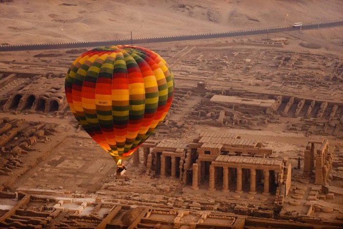 Sunrise VIP Hot Air Balloon Ride in Luxor - Above Luxor at sunrise: Statue of Thebes and the Nile’s morning glow
