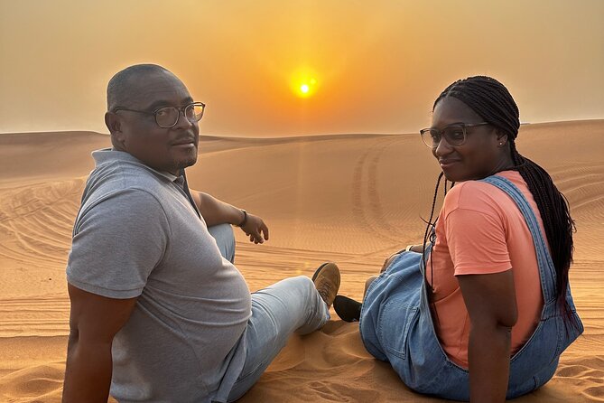 Sunset Desert safari with Camel Ride Sand Board & BBQ Dinner - Al Awir camp after sunset: camel ride, henna, and the quieter magic